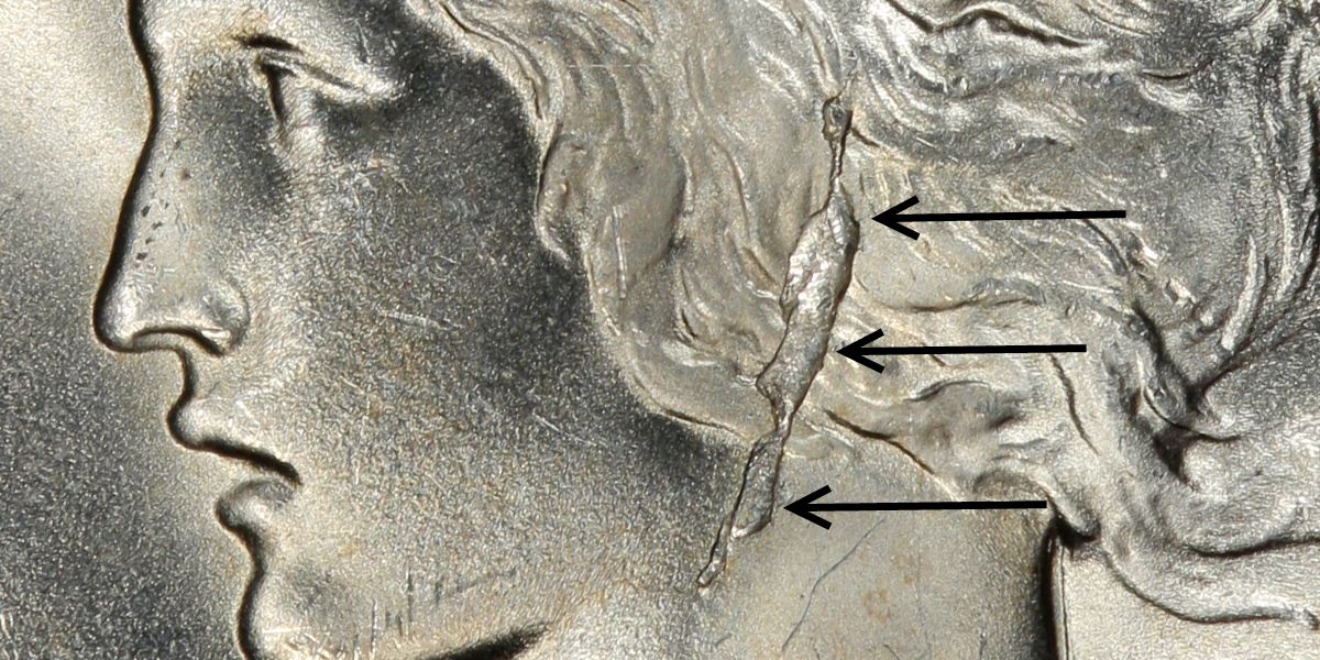 1922 Peace Dollar Earring VAM close-up showing blob-shaped die break behind Liberty's ear